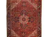 a red and black rug with a medallion design on a white background