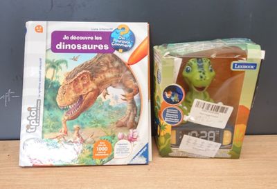 a box with a toy dinosaur and a box with a picture of a dinosaur