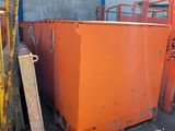 many orange containers sitting next to each other in a warehouse