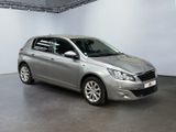 the silver car is parked in a large room with a white wall