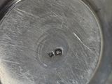 a close up of a metal pan with a metal lid