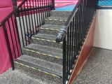 a staircase leading up to the top of a ramp