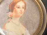 a picture of a woman in a white dress on a plate