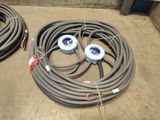 two hoses that are sitting on the ground