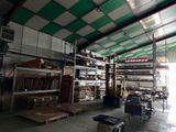 a large warehouse with a lot of shelves and boxes