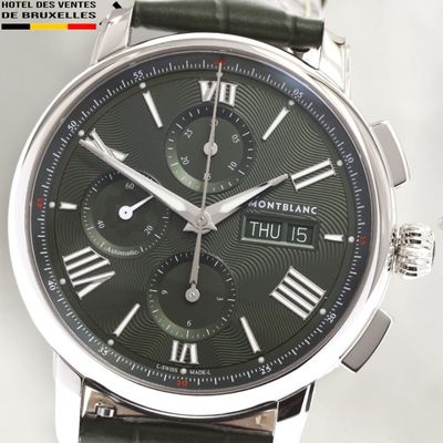 a close up of a watch with roman numerals on the face