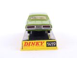 a green toy car sitting on top of a yellow box