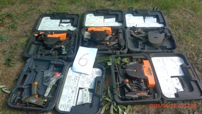 many different types of tools in a case on the ground