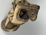 an old pair of shoes hanging on a wall