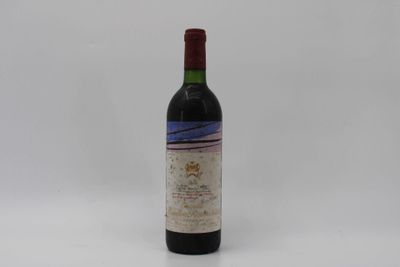 a bottle of red wine sitting on top of a white table