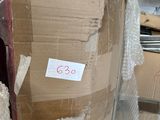 a box that is wrapped in plastic and sitting on a carton