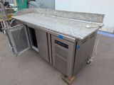 an image of a kitchen counter with two doors open