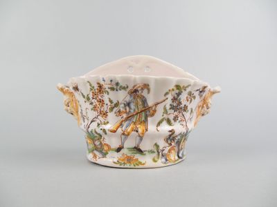 a small white bowl with a bird design on it