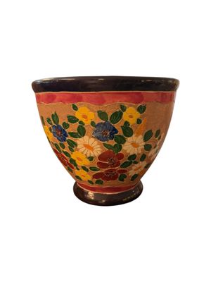 an image of a bowl with flowers painted on it