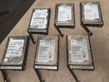 six hard drives sitting on top of a table next to each other