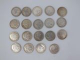 a close up of a bunch of coins on a white surface
