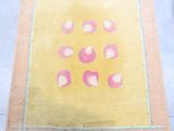 yellow area rug with pink hearts on it on a white floor