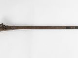 une image représentant un pistolet très ancien sur fond blanc