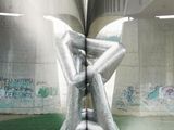 an open book with a picture of a sculpture inside of it