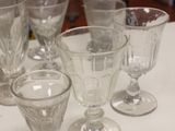 a lot of empty wine glasses sitting on a table
