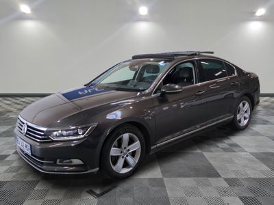 the volkswagen passat is parked in a large room with a checkered floor