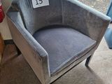 a chair that has a price tag on the back of it