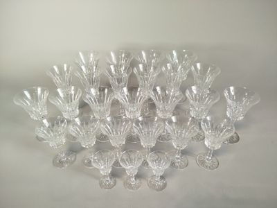 a lot of glasses that are sitting on a table