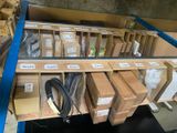 many boxes of electronics on a shelf in a store