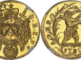 a gold coin with an image of a man holding a sword