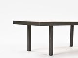 the table is made of wood and has a black metal base
