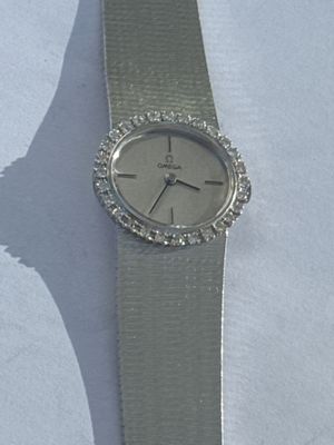 a watch that is sitting on a white table