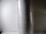 a large roll of foil wrapped in plastic on a table