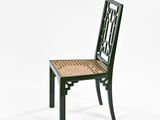 a black chair with a wicker seat on a white background