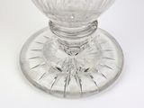 a clear glass bowl with a flower inside of it