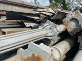 a pile of rusted metal pipes and pipes on the ground