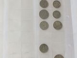 a lot of coins that are in a plastic container