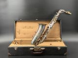 a saxophone that is sitting inside of a suitcase