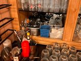 many empty wine glasses on a table in a room