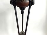 an image of a metal table with a bowl on top of it