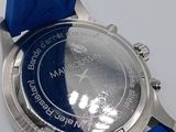 a close up of a watch with a blue strap