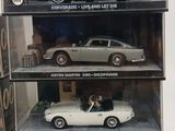 a display case with three different model cars in it