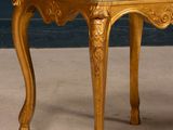 an image of a gold chair with a floral upholstered seat