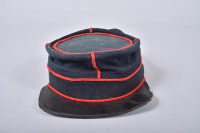 an image of a blue hat with red trims on a white surface
