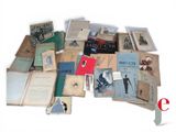 a pile of old books on a white surface