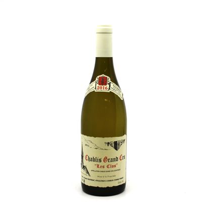 a bottle of wine that is sitting on a table