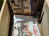 a lot of video games in a box on the floor