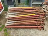 a pile of old rusty pipes sitting on the ground
