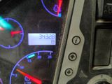 a close up of a car dashboard with a clock on it