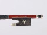 the bow is made of wood and has a red handle