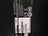 the back of a black box with a white sticker on it